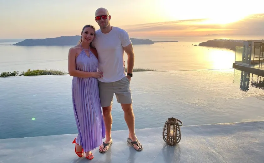 My wife and me at sunset by the sea.