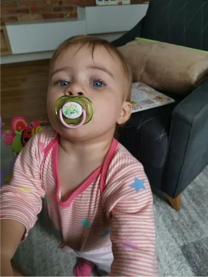 My daughter as a baby, pacifier firmly in place.